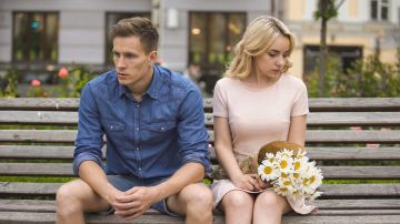 Unhappy,Couple,Sitting,After,Fight,,Girl,With,Flowers,,Problem,In